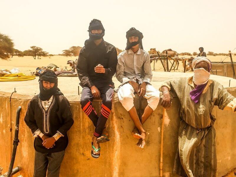 Nomads in the Sahara collecting water for their families