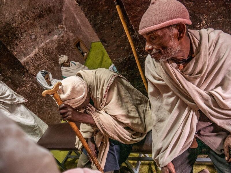 Pilgrims inside one of the rock-hewn churches of Lalibela