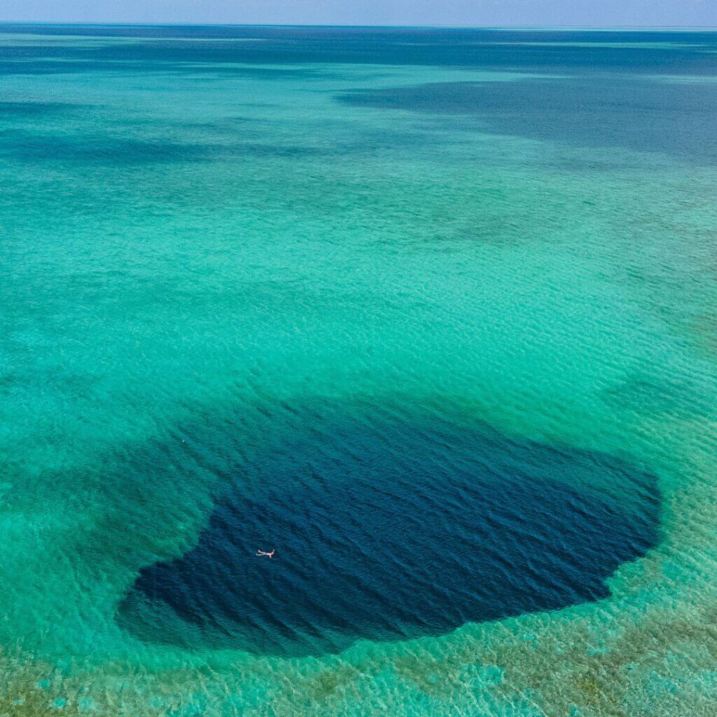 Taking a swim at the blue hole of central Acklins