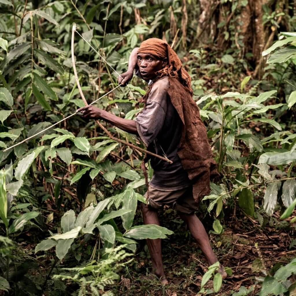 Batwa showing how the hunt for pigs and antelope inside the national parks