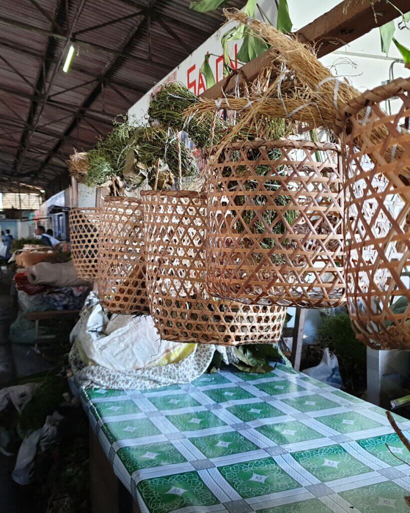 Fresh produce and handmade crafts at the vibrant Moroon Market in Paramaribo, Suriname.