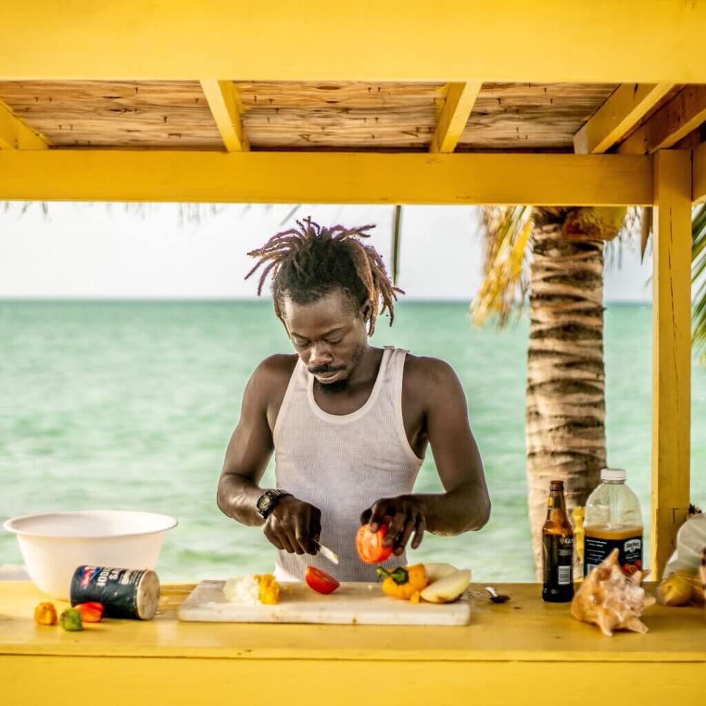 A conch man selling fresh conch salat in northern Acklins