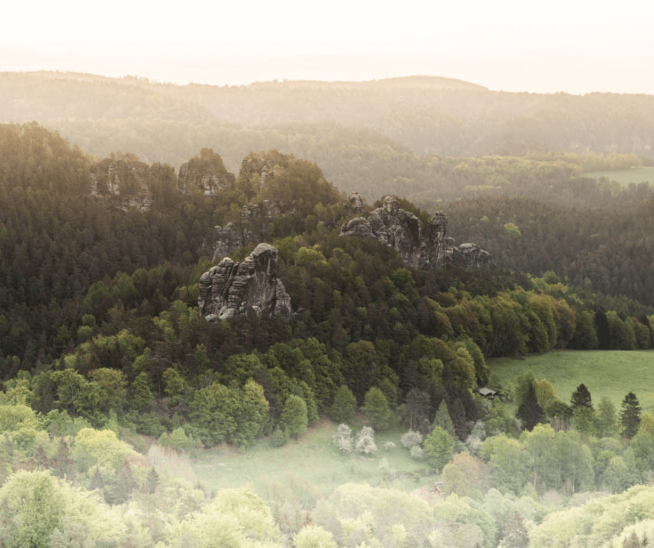 Stunning morning views of misty valleys and rugged rock formations in Saxon Switzerland National Park