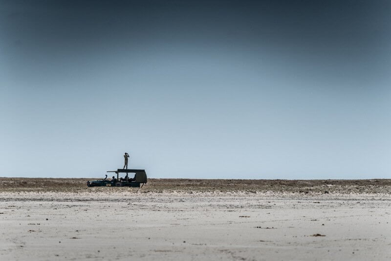 My safari guide looking for a predator wandering around Makgadikgadi Pans