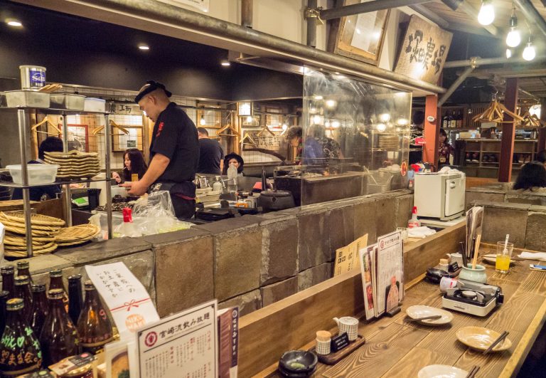 Chefs prepare their food in front of their guests