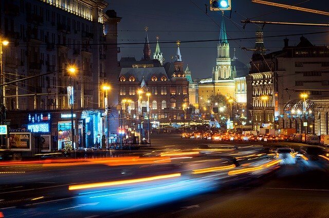 Night view of Moscow, featuring illuminated buildings and the city's vibrant skyline.