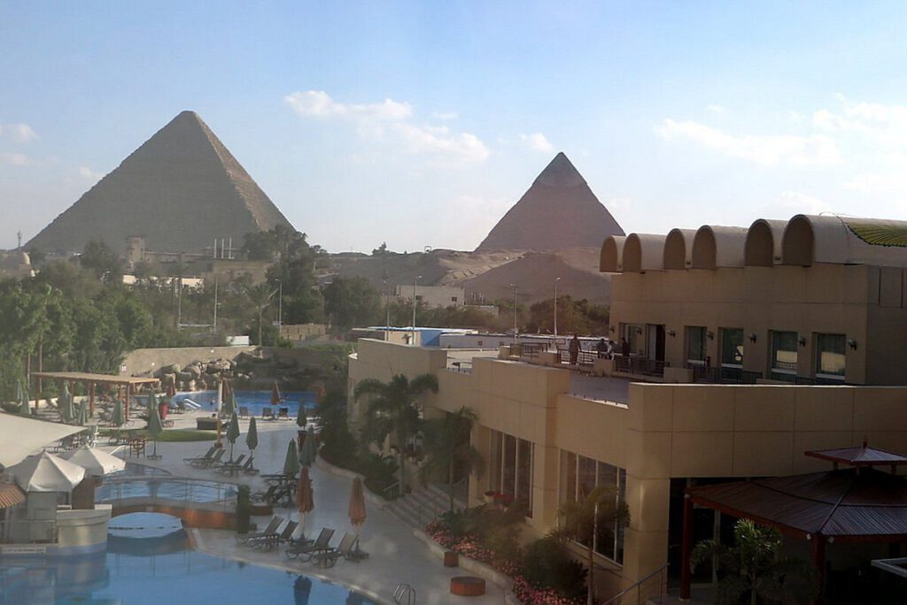 Le Méridien Pyramids Hotel & SpaLuxury amenities with a direct view of the pyramids from the pool