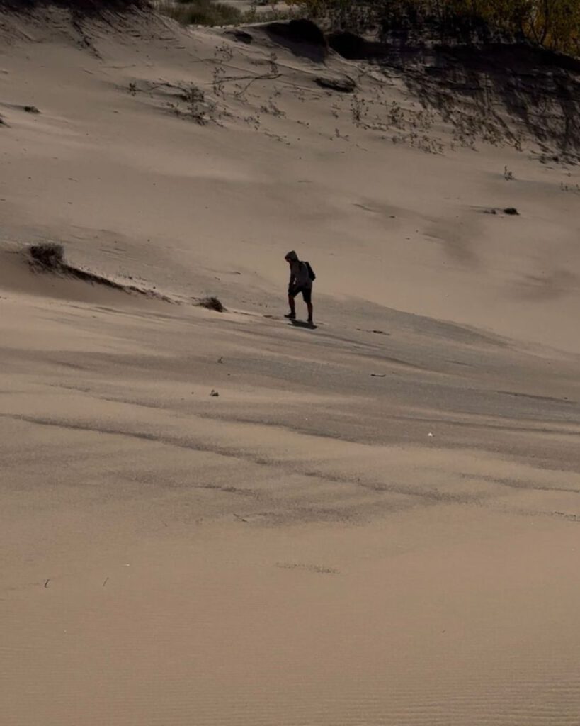 In autumn, forests framing the dunes glow, and Lake Michigan often appears calm and reflective.